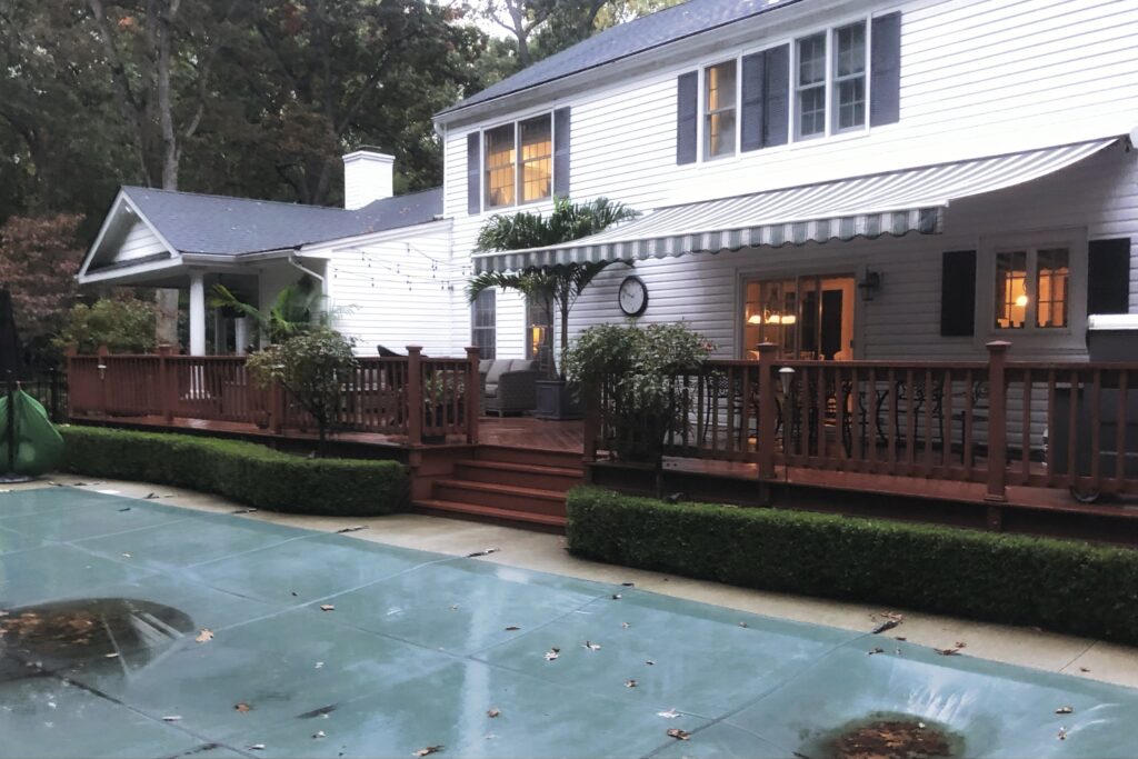 Backyard deck demolition before new stone patio installation