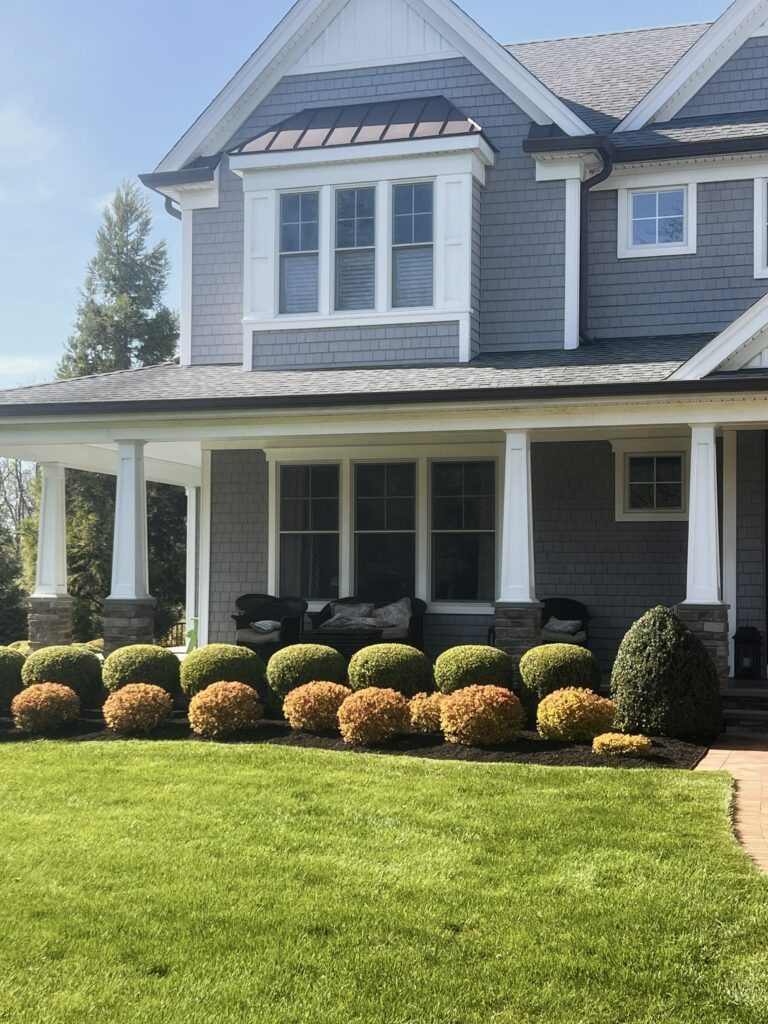 Front planting bed with fresh mulch and seasonal landscape plants
